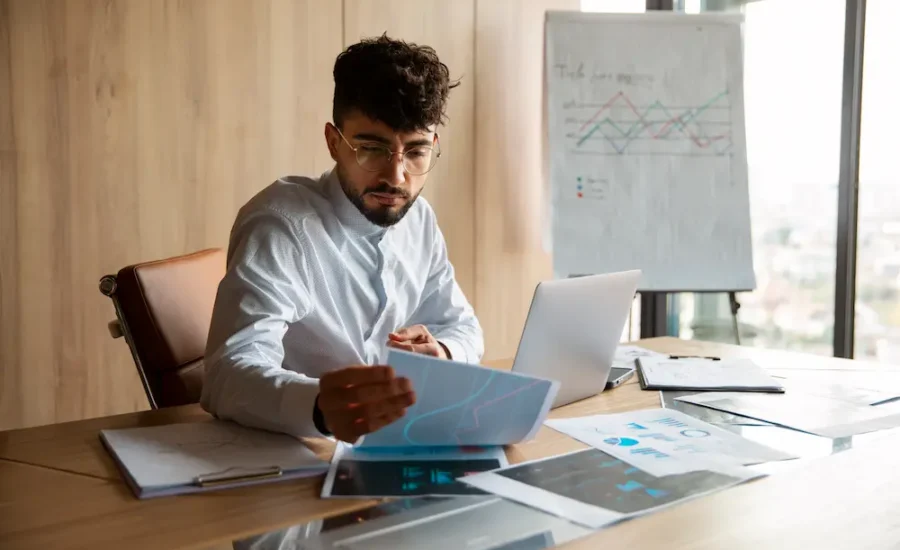 Financial controller reviewing month-end reconciliations and supporting schedules
